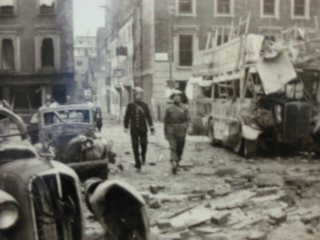 Wardens viewing a bombing scene