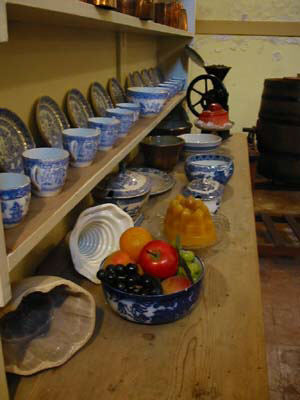 welsh dresser with plates pots and a jelly - yum yum